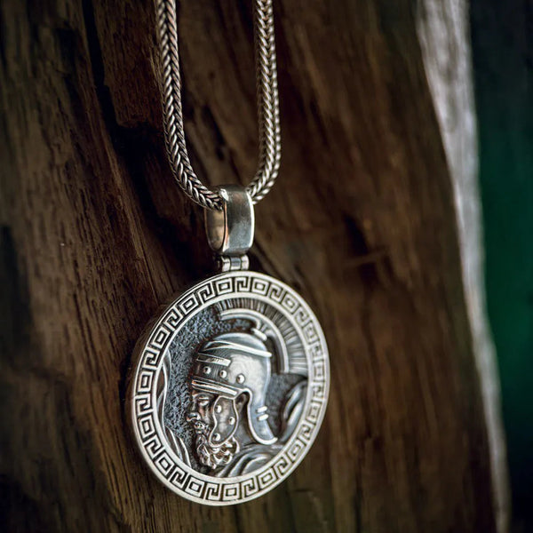 Silver pendant necklace on a wooden surface